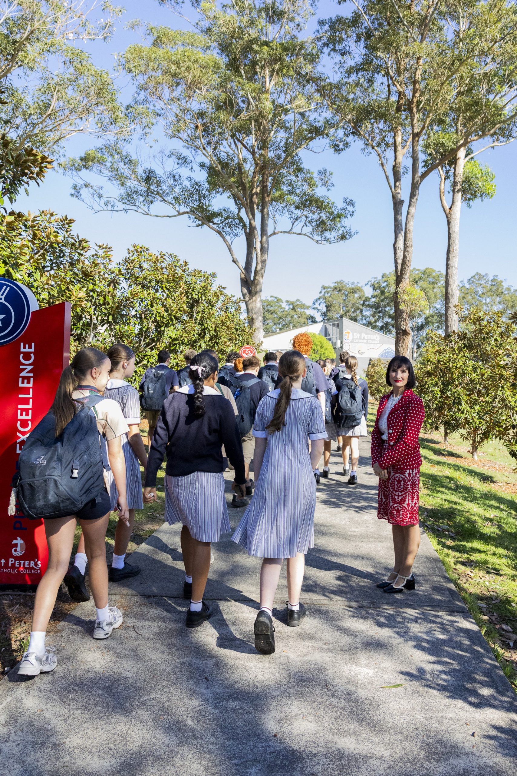 St Peter’s Principal with students on the College grounds